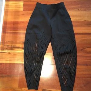 Fabulous Lululemon Lab black pants with cutouts.